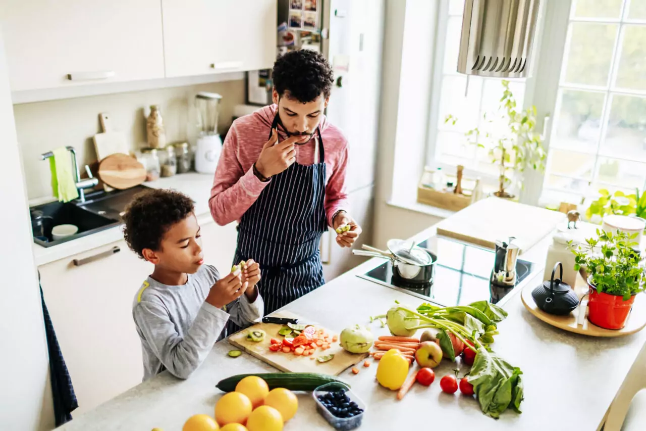 Father and Son in Kitchen with Induction Stove