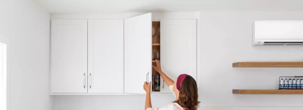 Woman in Kitchen with Mini-Split Heat Pump