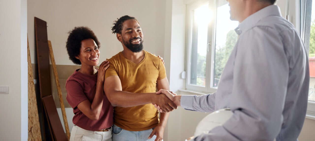 Couple Shaking Hands with Contractor