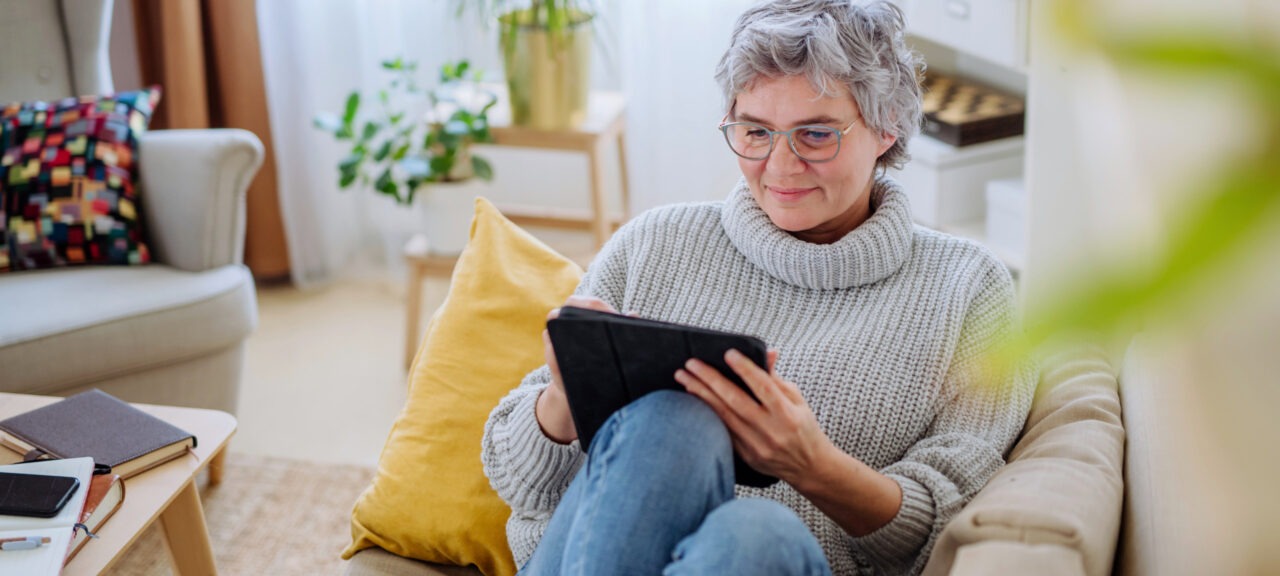 Woman on Couch with Tablet